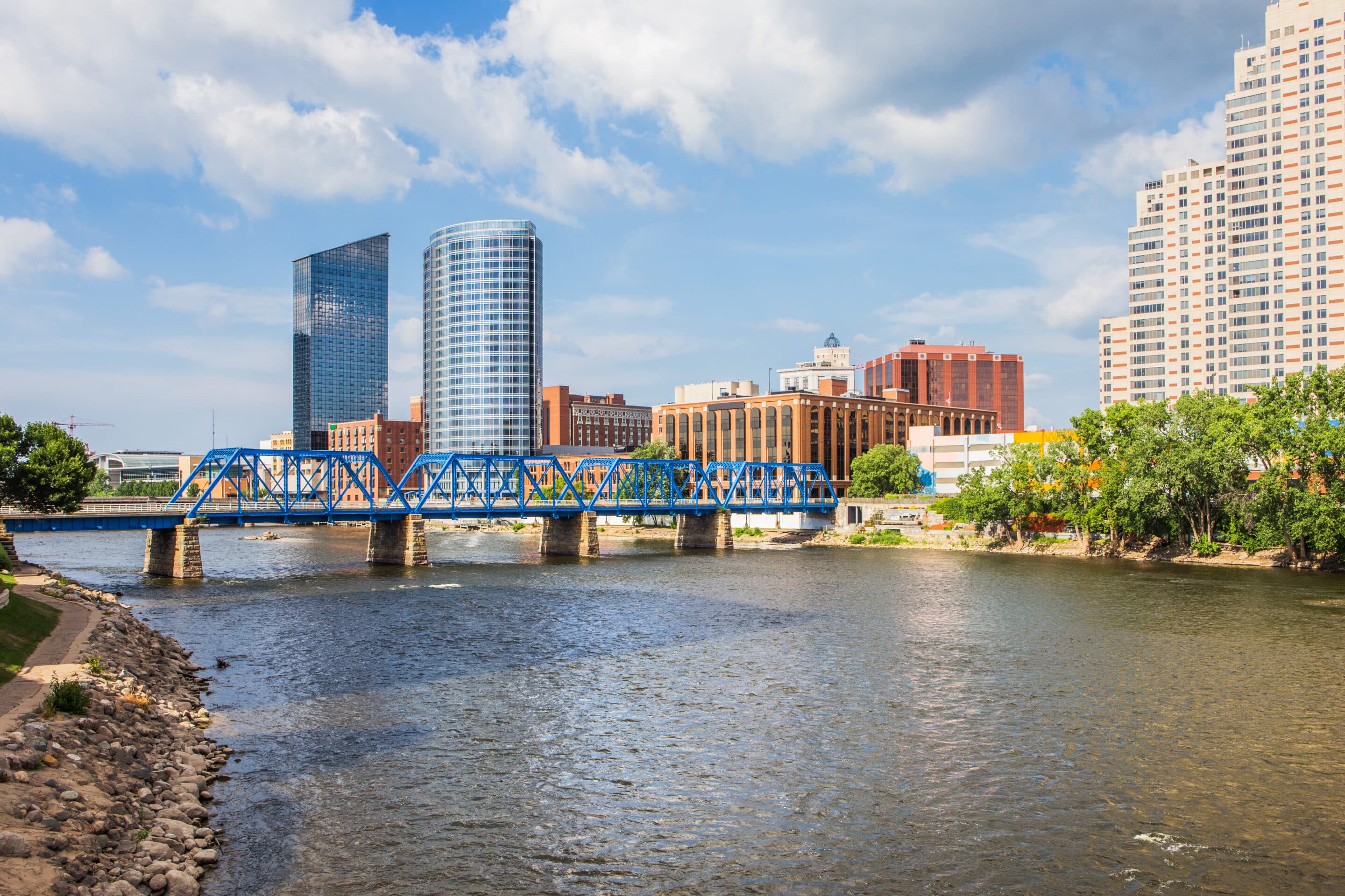 Blue pedestrian bridge crossing the Grand River in downtown Grand Rapids, Michigan.