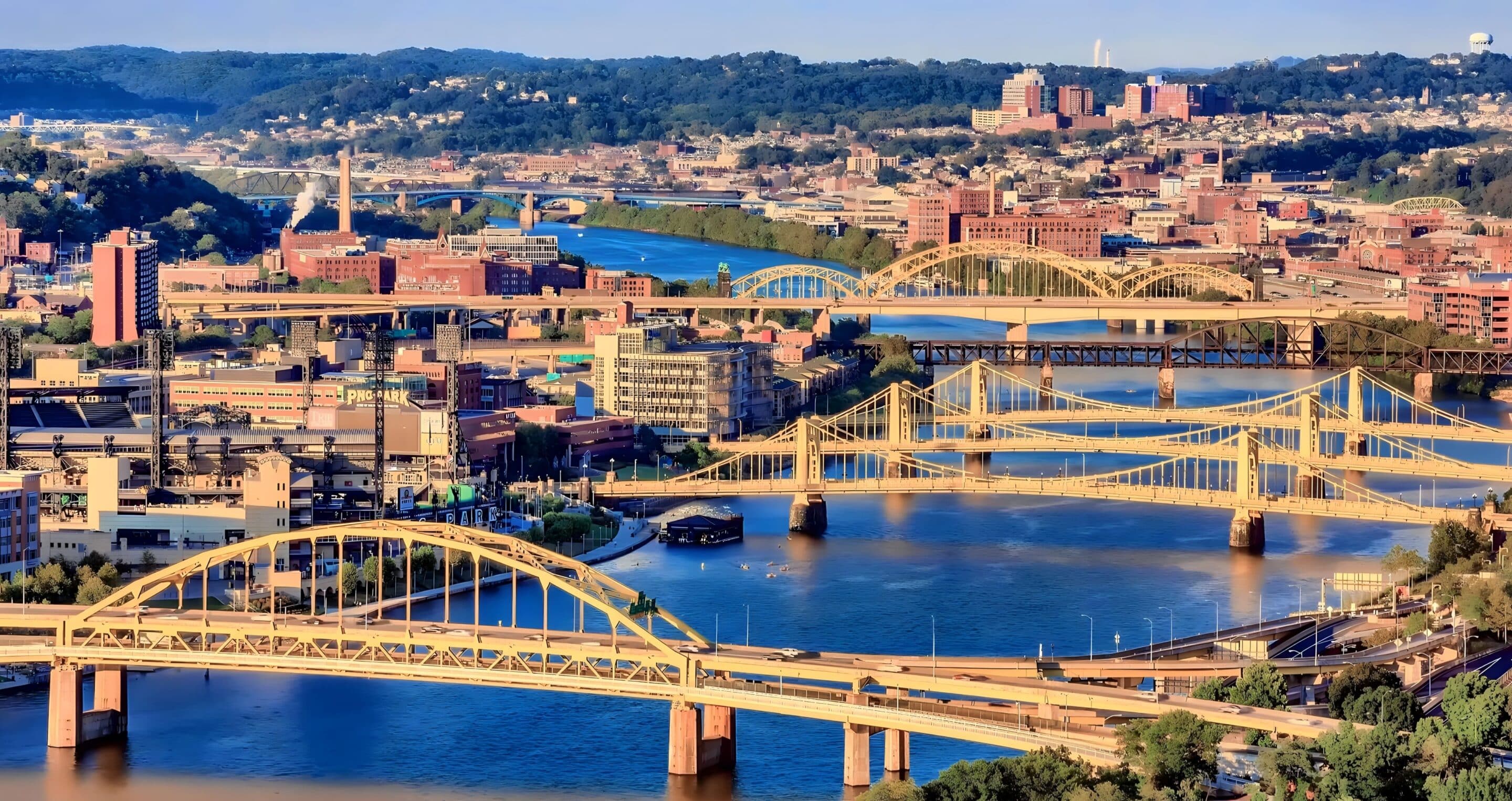 Multiple bridges spanning the Allegheny, Monongahela, and Ohio Rivers in downtown Pittsburgh.