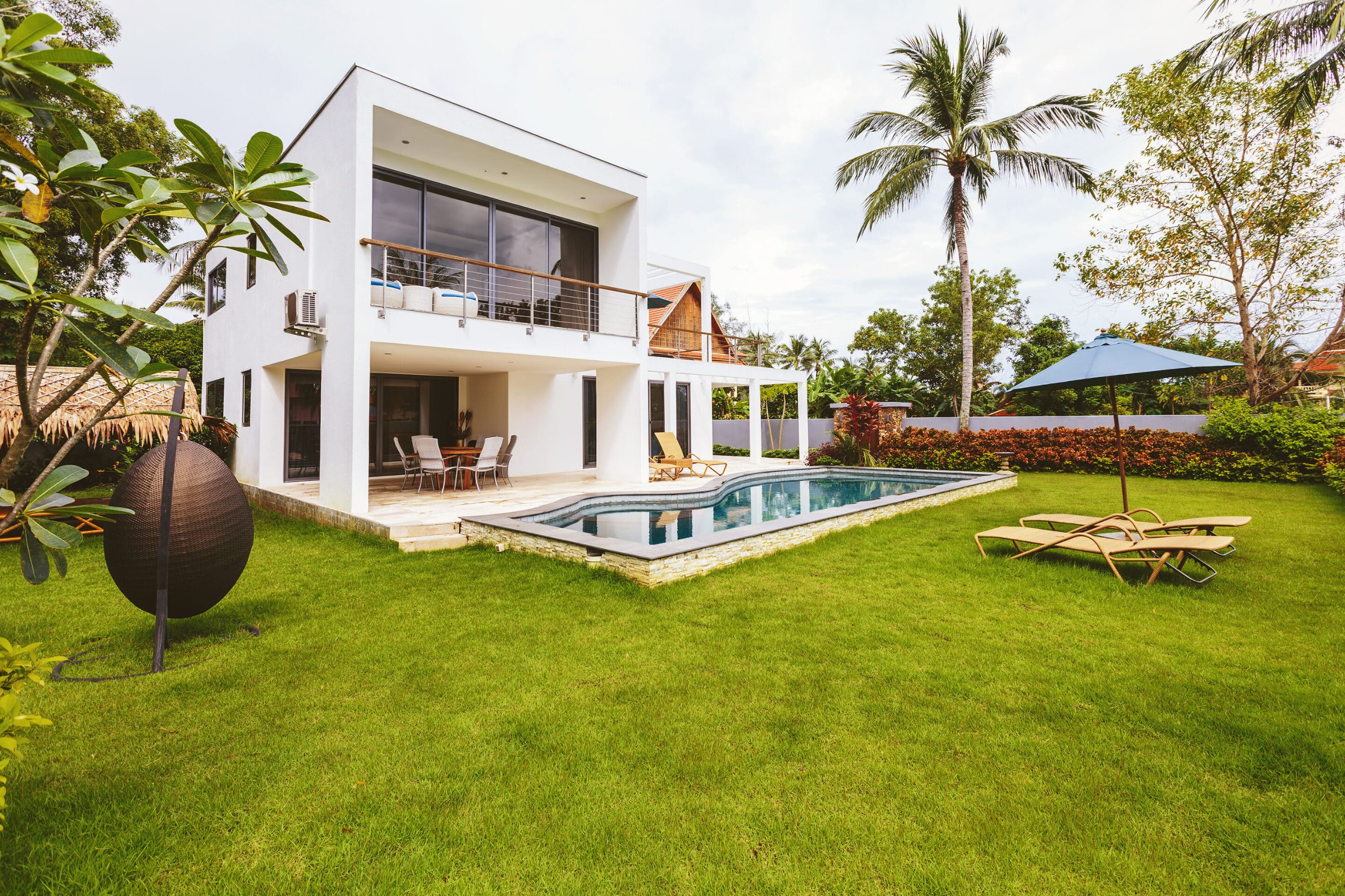 Vacation Property Insurance for Luxury Tropical Homes Tropical vacation home with private pool covered by vacation property insurance.