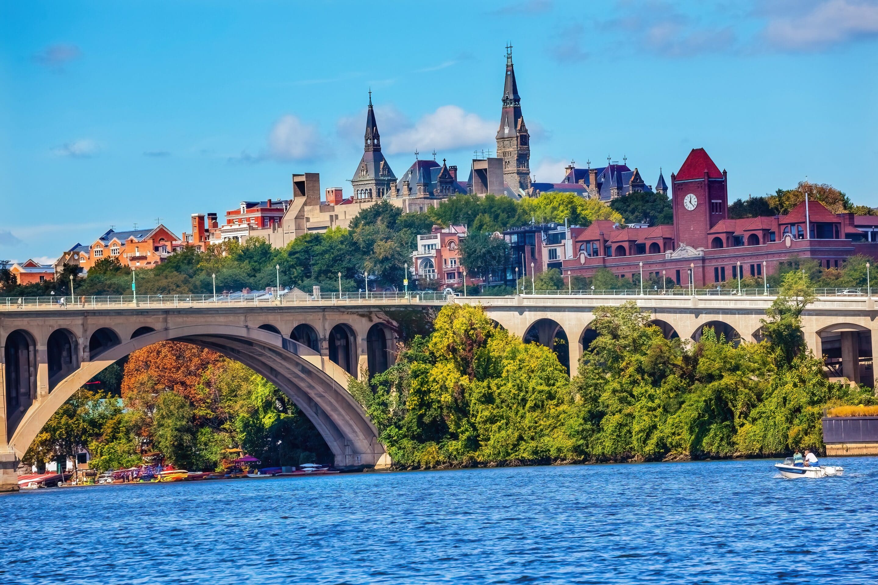 View of Key Bridge and historic Georgetown buildings near the Potomac River, a frequent flood zone in Washington DC.