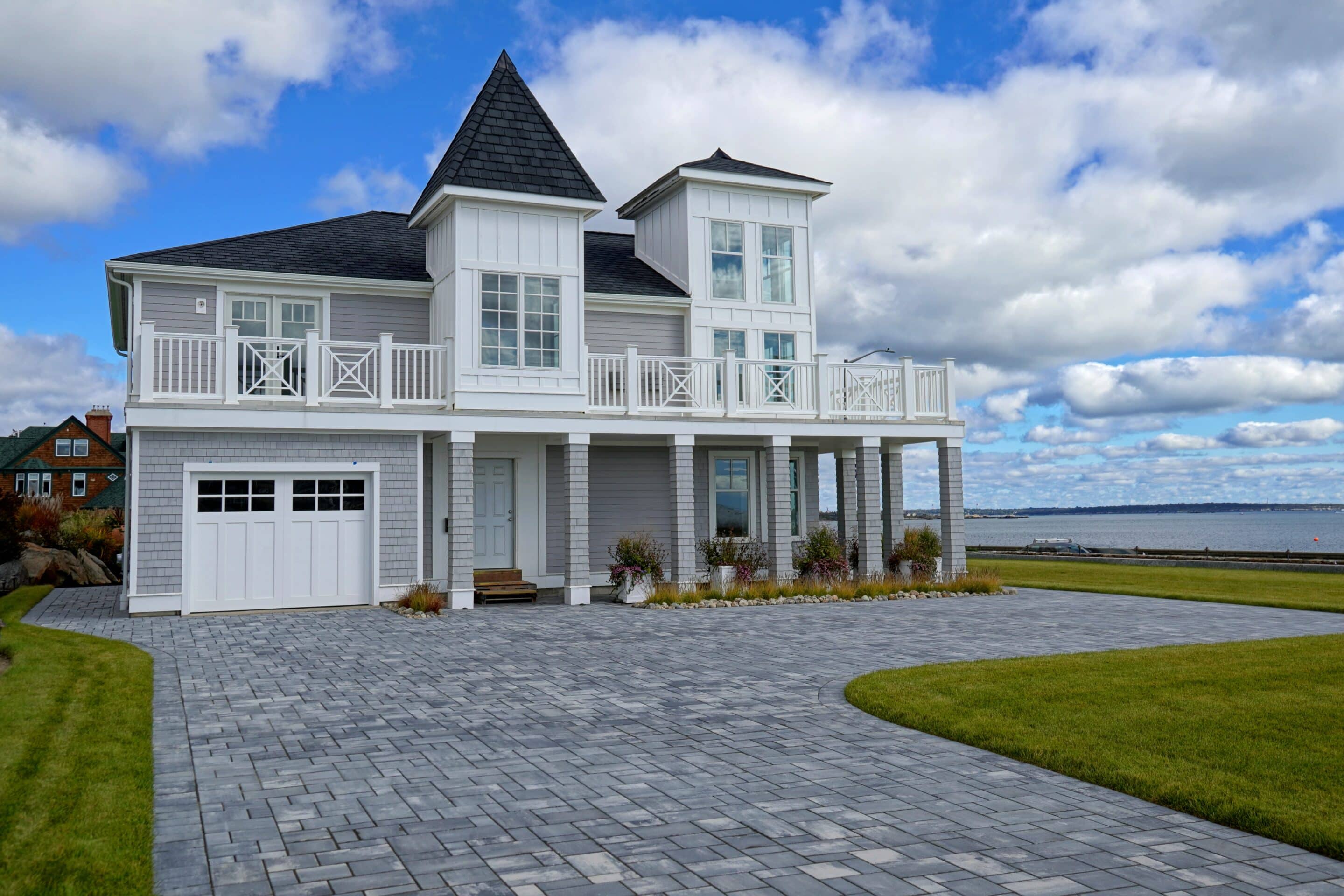 Modern luxury oceanfront home with raised foundation, ideal for oceanfront property insurance coverage.