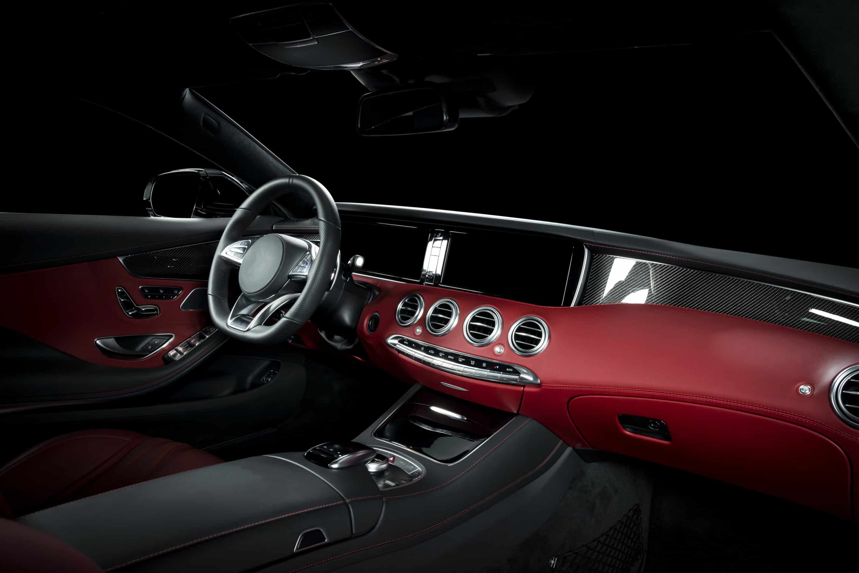 American Collectors Insurance classic car interior showing red leather and carbon fiber trim